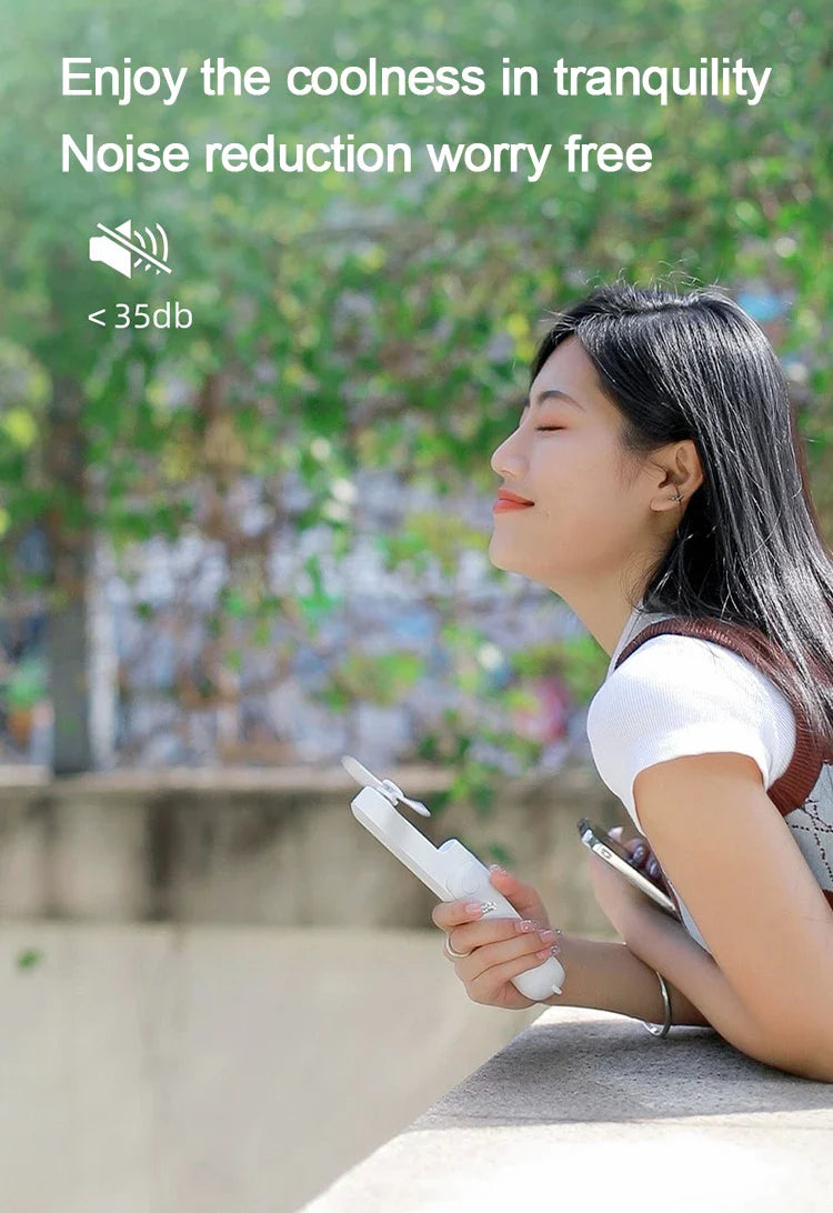Foldable Rechargeable Mini Fan by DERILUJA LLC